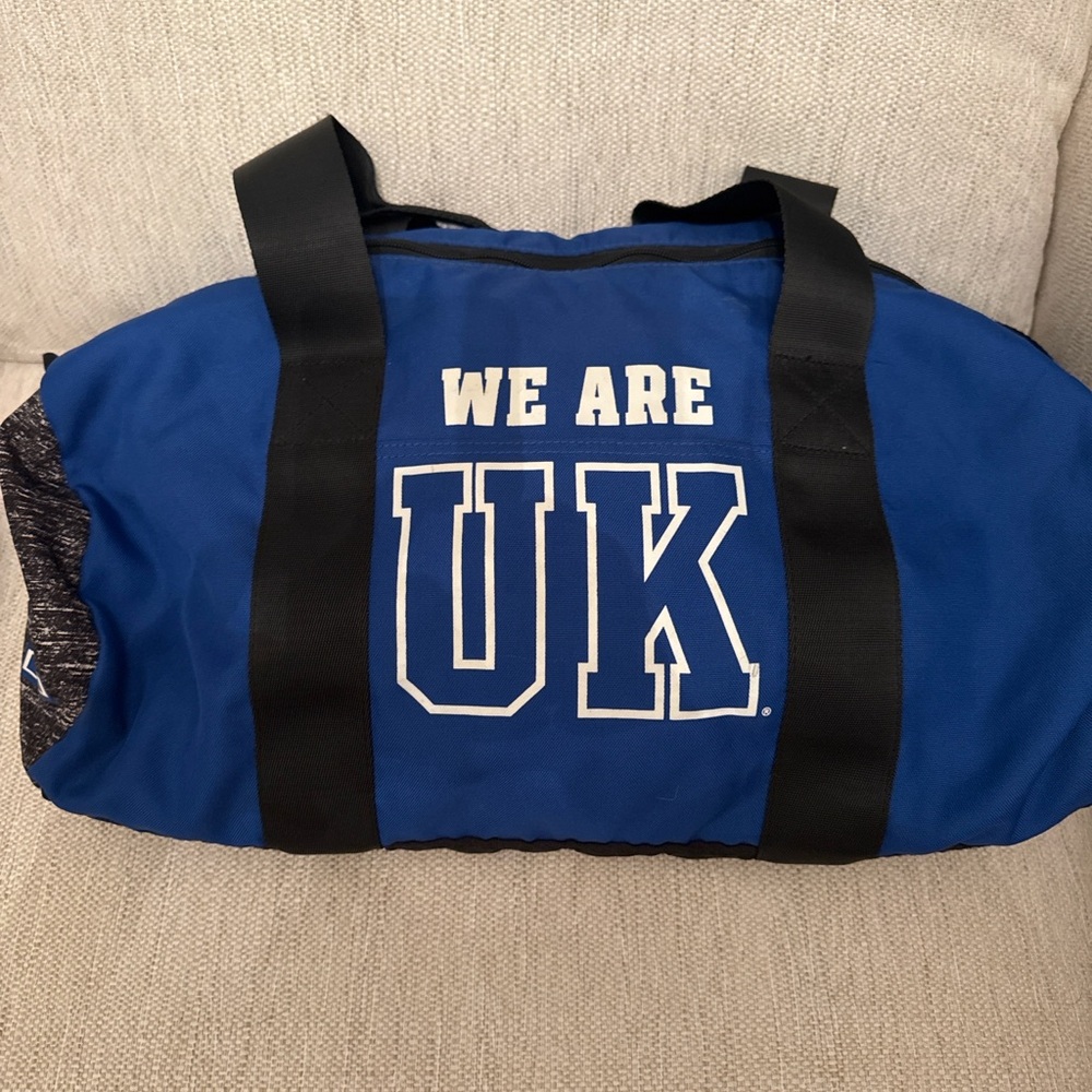 PINK BRAND. NEW!!  “ We are UK” black, and blue duffel bag.